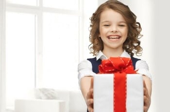 a happy kid providing gift