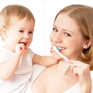 mum-baby-brushing-sq-300