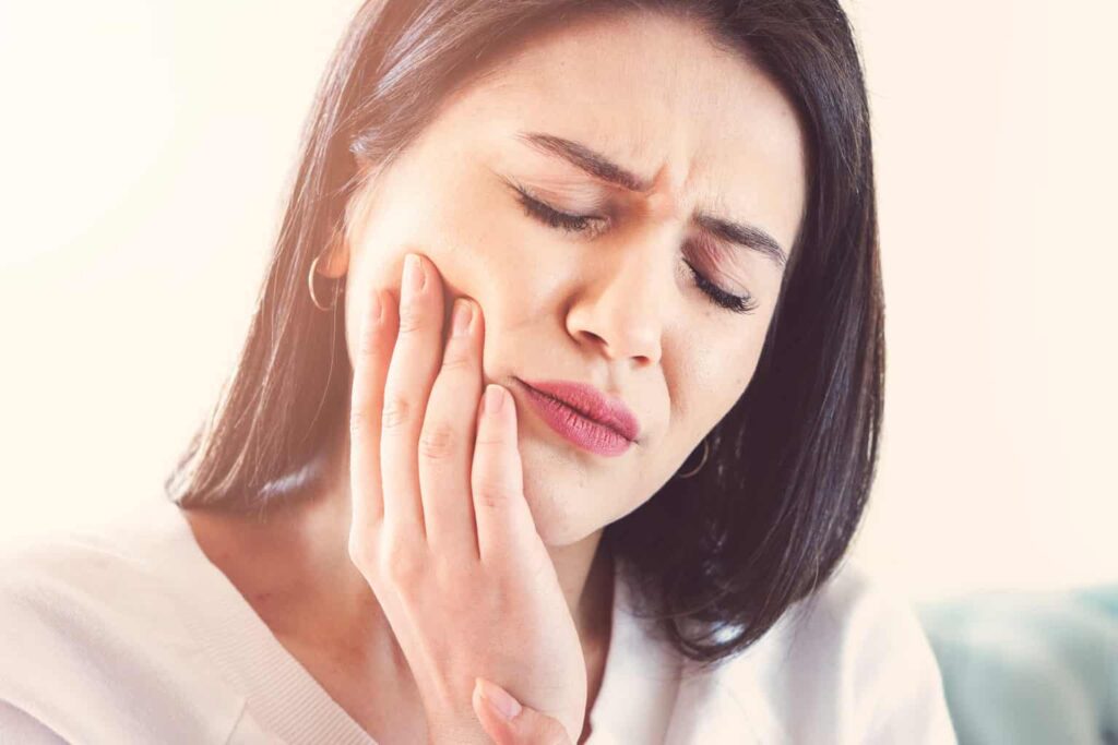 why does tooth hurt after touching?